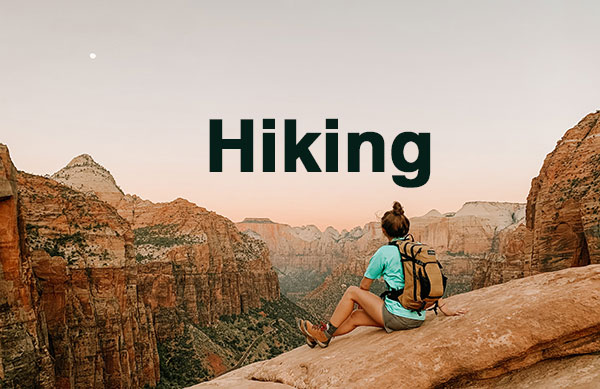 hiker at top of mountain